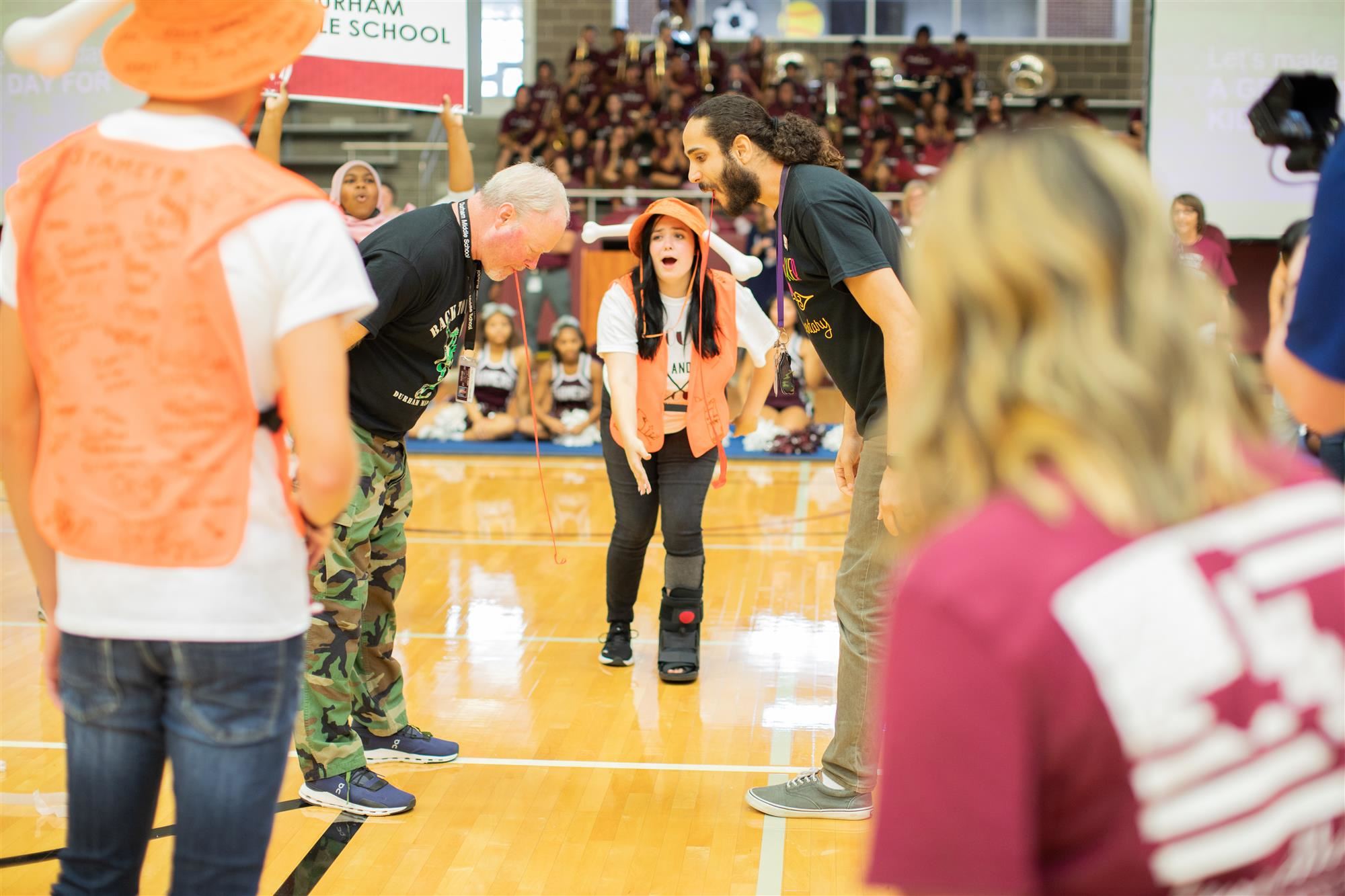 Teachers participate in a competition to eat a Fruit-by-the-Foot the fastest